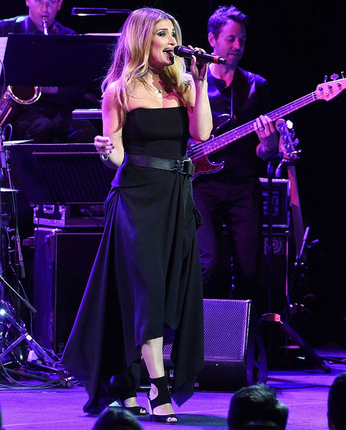 Idina Menzel wore a black strapless dress with black belt detail