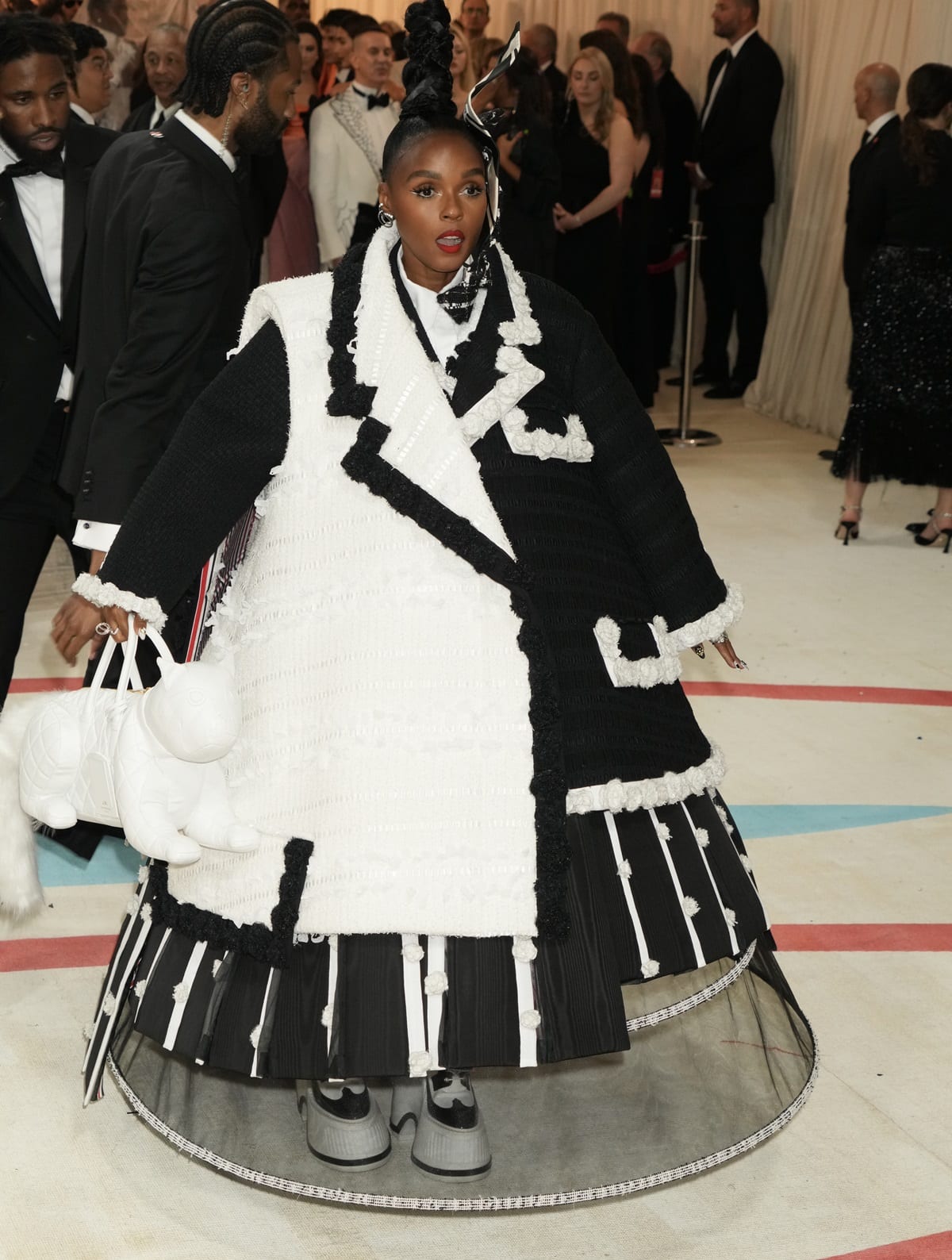 Janelle Monae donned an extravagant black-and-white tweed Thom Browne tuxedo suit at The 2023 Met Gala Celebrating "Karl Lagerfeld: A Line Of Beauty"