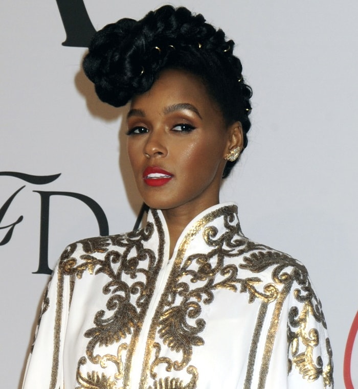 Janelle Monáe Robinson wore a white and gold embroidered cape dress from Tadashi Shoji