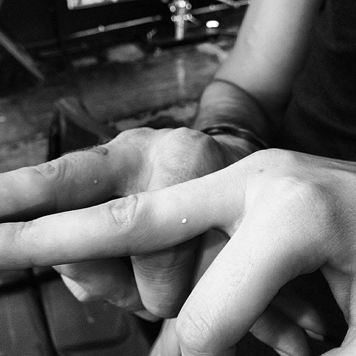 Kendall Jenner's white dot tattoo on her middle finger