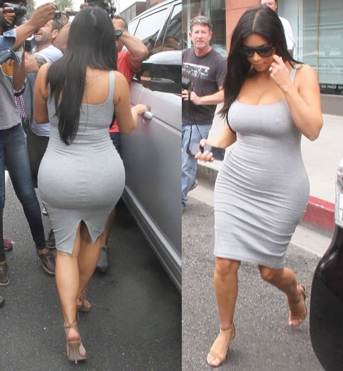 Kim Kardashian showcases her curves in a sleek grey bodycon dress, paired perfectly with ankle-strap heels and oversized sunglasses