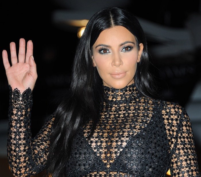 Kim Kardashian styled her raven hair into long and loose waves