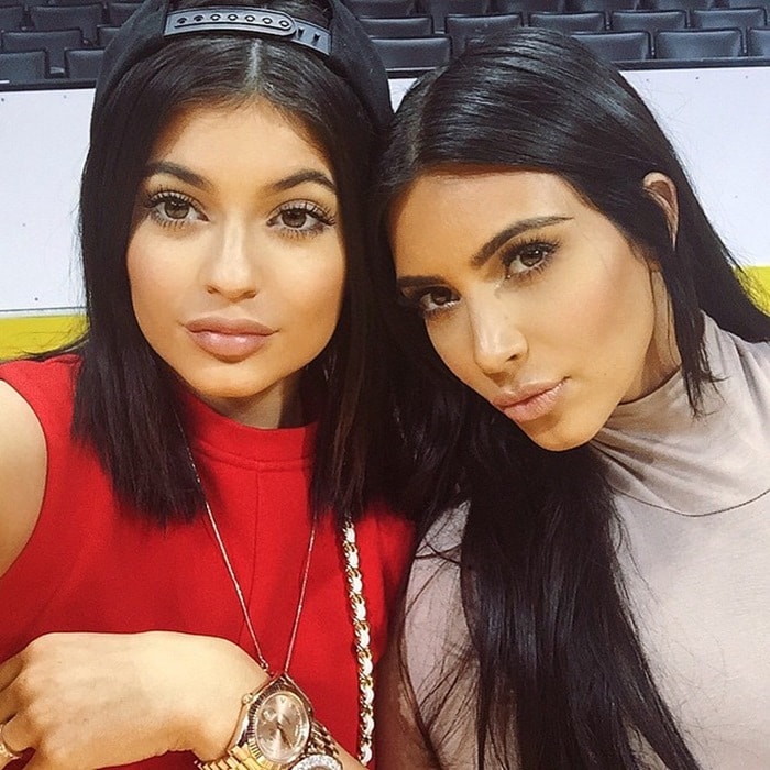 Kim Kardashian and Kylie Jenner with matching raven locks and similar dark eyes