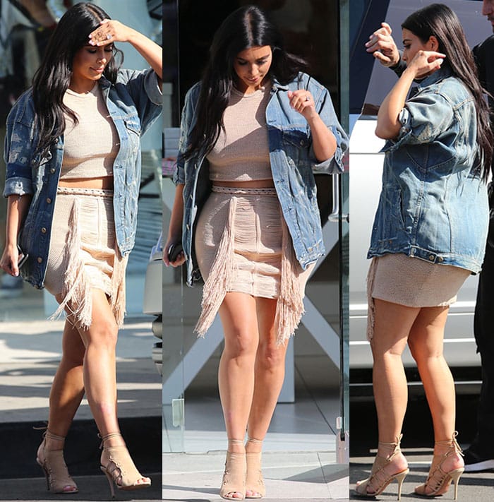 Kim Kardashian showing off bare baby bump while visiting a Dash store
