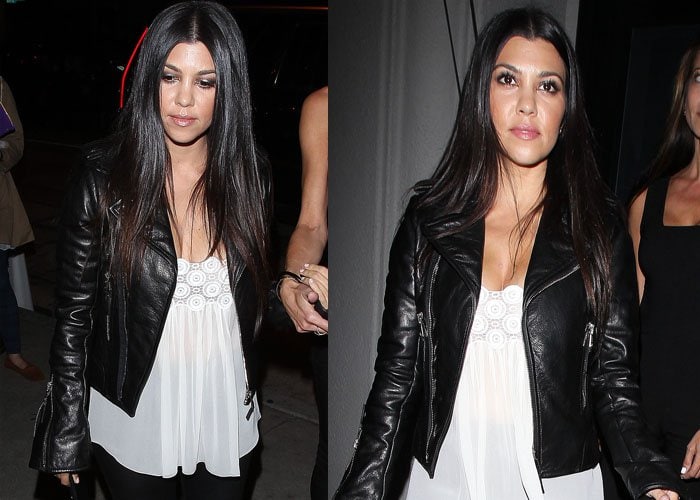 Kourtney Kardashian wore her hair straight and parted in the middle