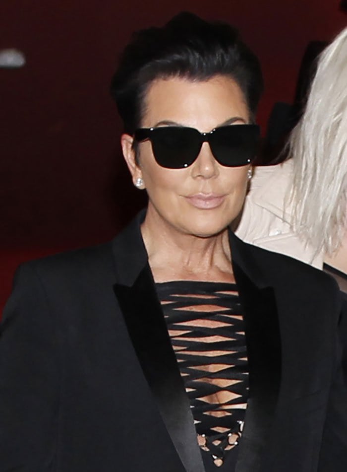Kris Jenner's raven hair was brushed up into a quiff