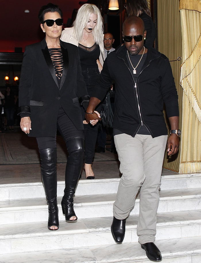 Kris Jenner wore a bondage-like bodysuit with a plunging crisscross-lace-detailed top and fitted pants