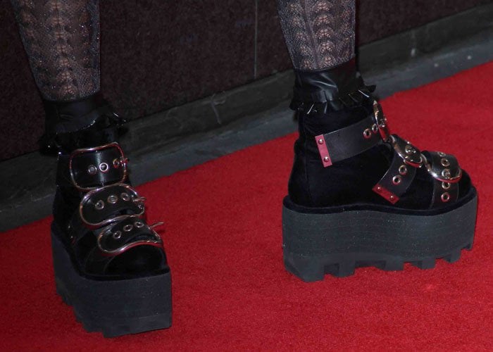 Lady Gaga with ruffled leather socks tucked into her boots