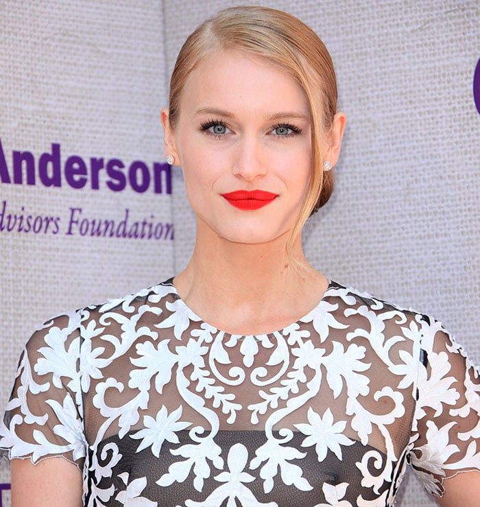 Leven Rambin styled her blonde hair into a low-rolled side-part updo