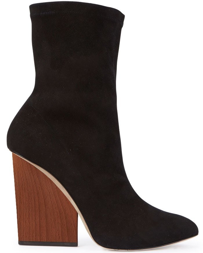 This boot by Maiyet features a black stretch suede body and chunky wooden wedge heel