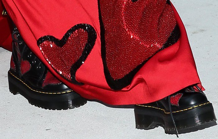 Miley Cyrus wore a pair of patterned Dr. Martens, which matched her custom heart-printed Moschino gown by Jeremy Scott