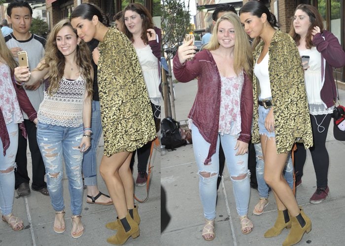 Selena Gomez takes photos with fans after leaving her hotel in New York