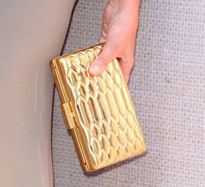 Sharon Stone toting a gold Roberto Cavalli clutch