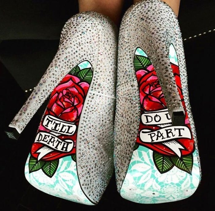 Exuding elegance, these silver pumps are encrusted with rhinestones, boasting a 6-inch heel and a 1-inch platform, while the sole is a canvas of colorful flowers and the declaration Till Death Do Us Part