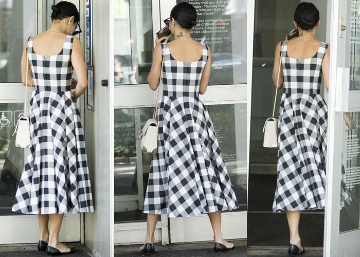 Vanessa continued to keep her face hidden as she approached her bank, turning away from the cameras and flashing a glimpse of the tattoo on her neck