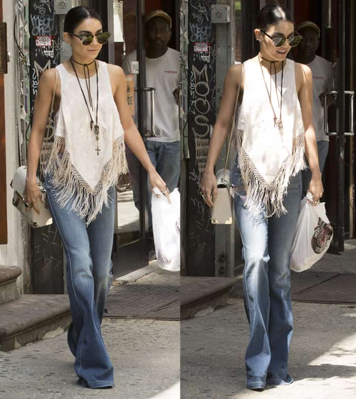 Vanessa Hudgens steps out in New York City wearing J Brand's Demi high-rise flare jeans, pairing them with a fringed tank top for a chic bohemian look