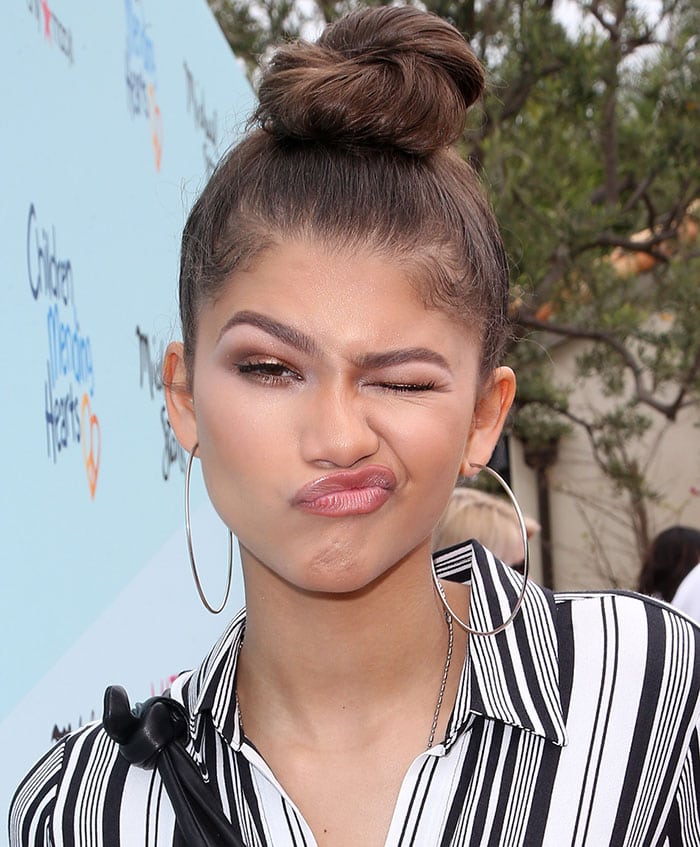 Zendaya's topknot hairstyle and bronzy makeup