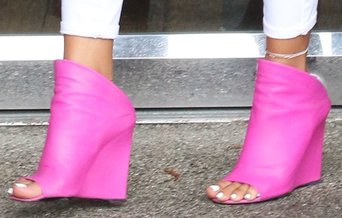 Karrueche Tran shows off her sexy toes in bright pink Balenciaga wedge mules