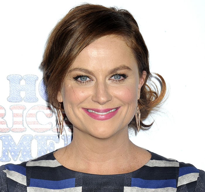Amy Poehler pulled her auburn hair up into a chic messy updo