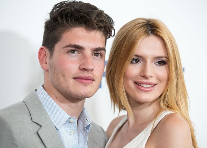 Actress Bella Thorne and her beau Gregg Sulkin pose together for a photo on the red carpet at the 6th Annual Thirst Gala held at The Beverly Hilton hotel in Los Angeles on June 30, 2015