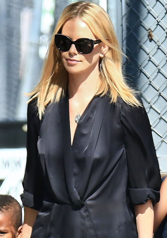 Charlize Theron's oversized tie-front black blouse