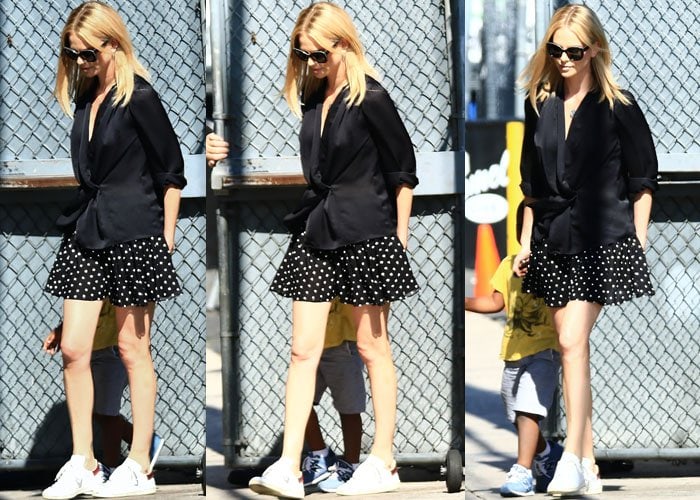 Charlize Theron flaunted her legs in a swing polka-dotted skirt