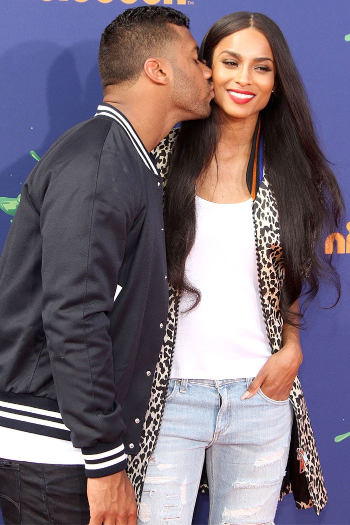 Ciara getting a kiss on the cheek from boyfriend Russell Wilson