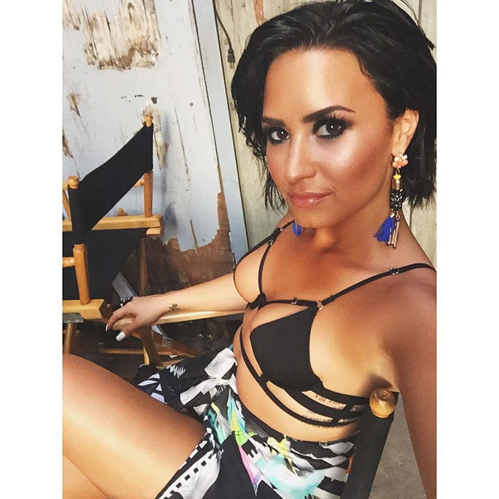 Demi Lovato poses in an Instagram picture featuring her bondage-style controversial concert costume