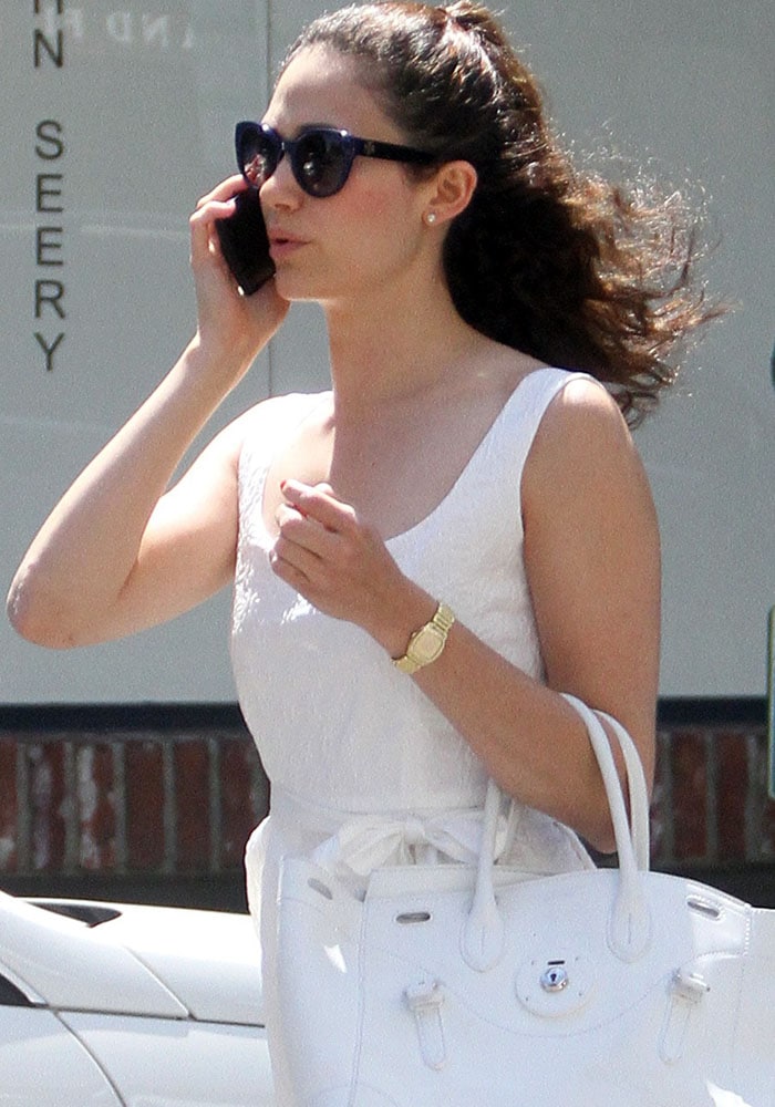 Emmy Rossum talking on her cellphone