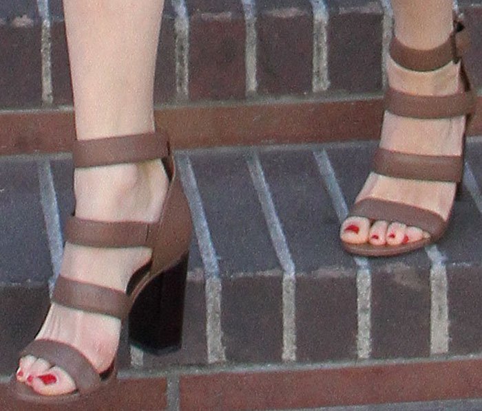 Emmy Rossum's sexy feet in brown strappy heels