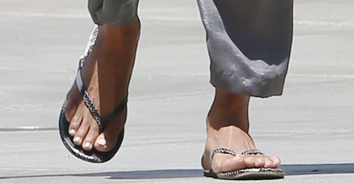 Halle Berry showed off her feet in reptile print flip-flops from TKEES