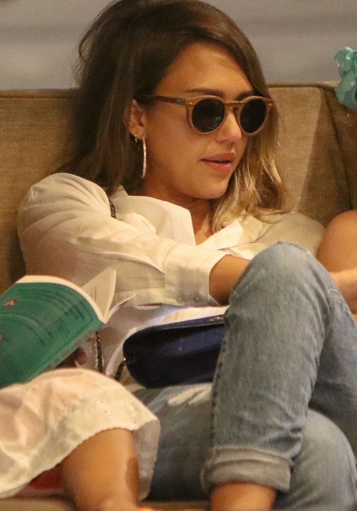 Jessica Alba hides behind a pair of sunglasses