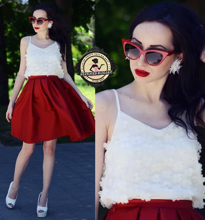 Karina styled a red skirt with a white floral top and white pumps