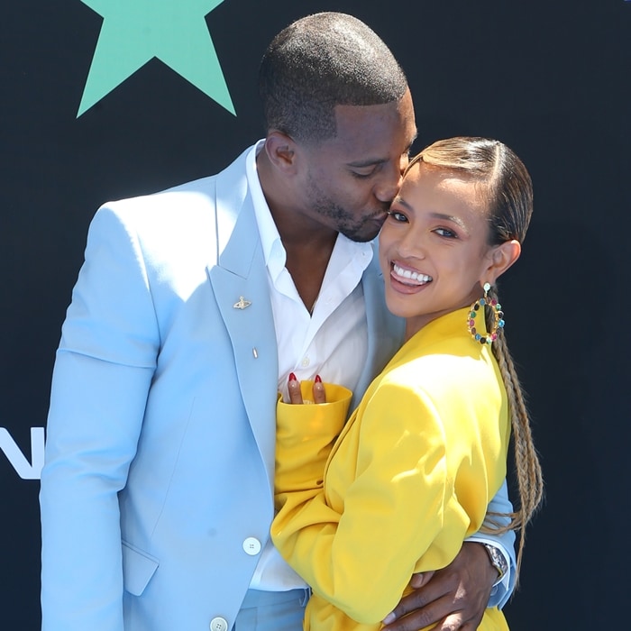 Karrueche Tran gets a kiss from Super Bowl XLVI champion Victor Cruz