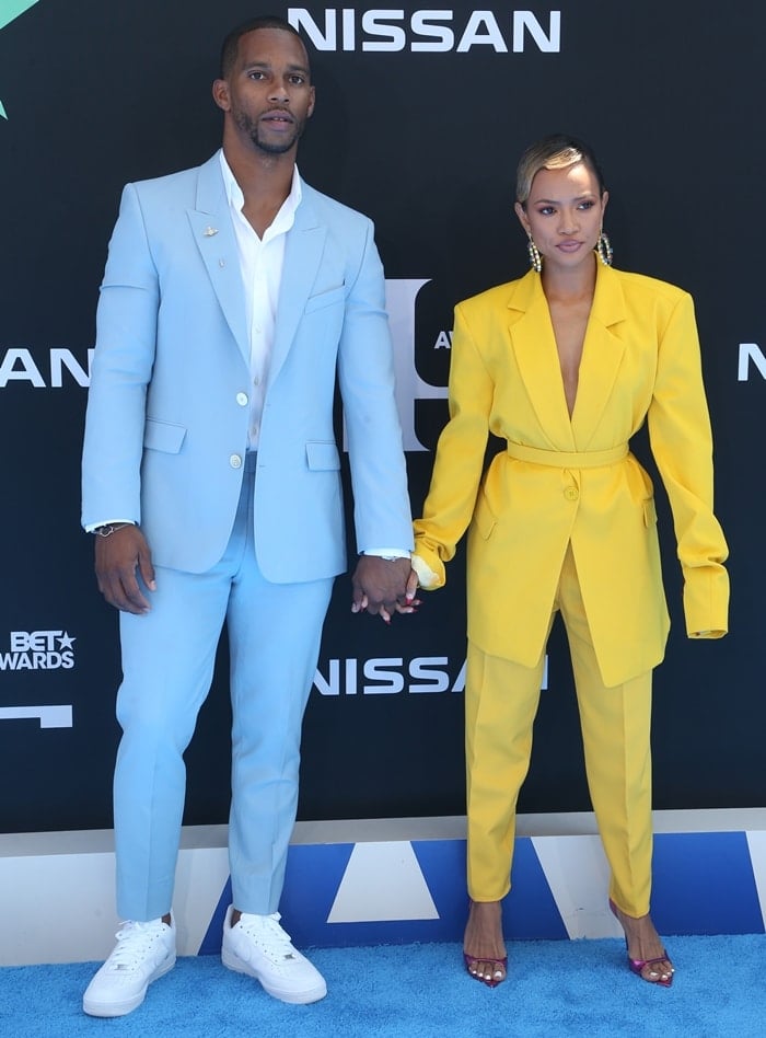 Karrueche Tran and Victor Cruz hold hands at the 2019 BET Awards