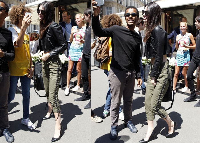 Kendall Jenner makes a stop at a Chanel boutique in Paris while showing off her toned midriff on July 6, 2015