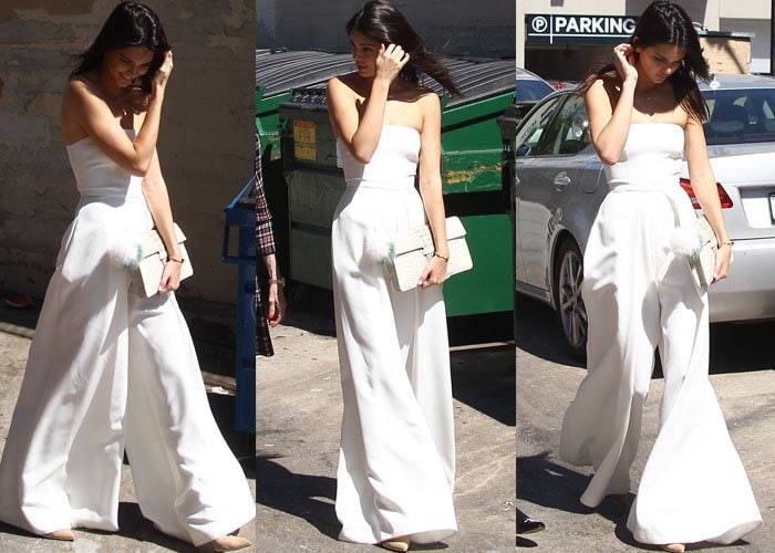 Kendall Jenner shows off a strapless, wide-legged all-white jumpsuit as she goes for a stroll in LA