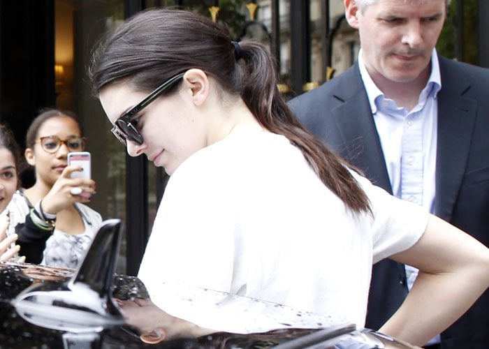 Kendall Jenner went makeup-free and tied her brunette tresses back into a simple pony