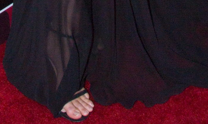 Kendall Jenner's unpainted toenails peek out from the open-toed design of her Stuart Weitzman "Nudist" sandals