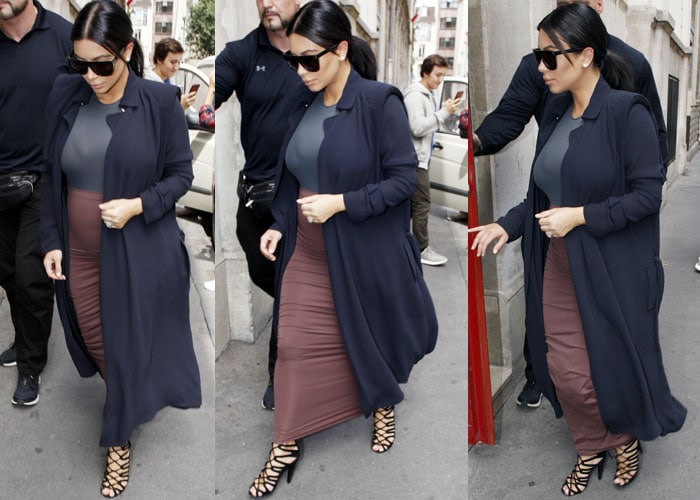Kim Kardashian changes into her second outfit for the day while going around Paris on July 21, 2015