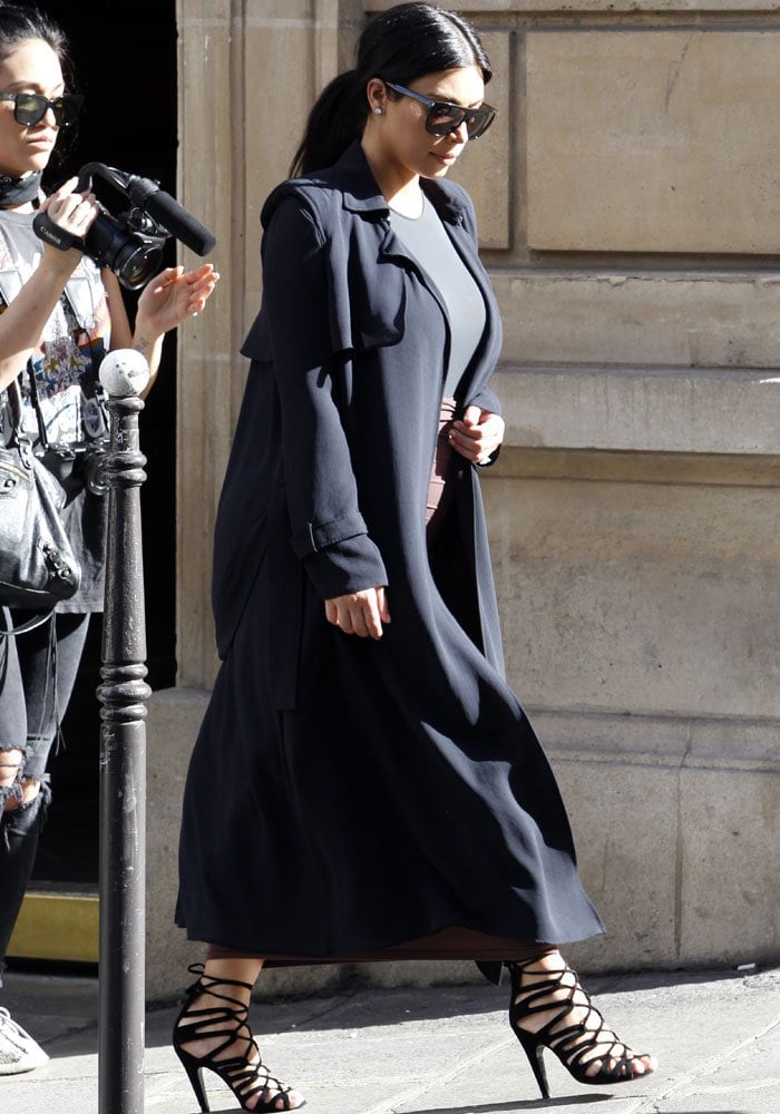 Kim Kardashian changes into her second outfit for the day while going around Paris on July 21, 2015