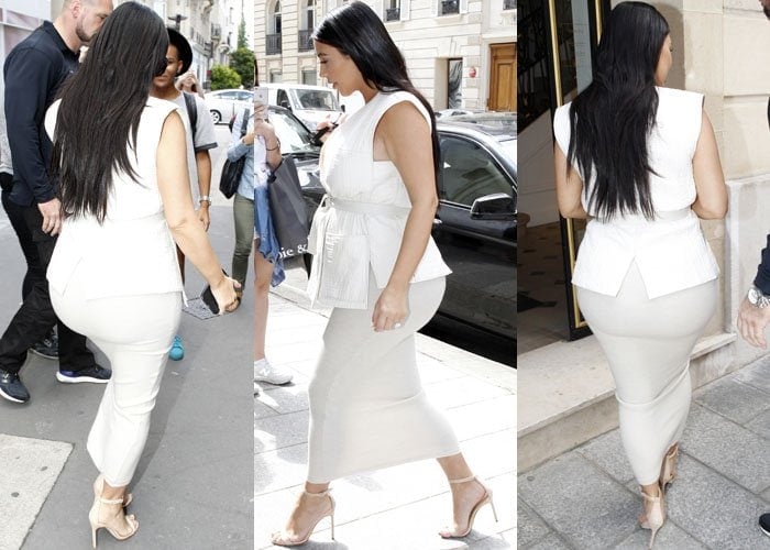 Kim Kardashian wore a top by Isabel Marant, a skirt by Donna Karan, sunglasses by Céline, and a pair of suede Manolo Blahnik 'Chaos' heels in nude