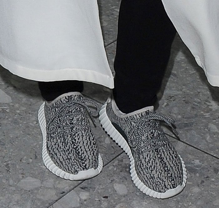 Kris Jenner shows off the detail of the Yeezy Boost 350 sneakers by Kanye West