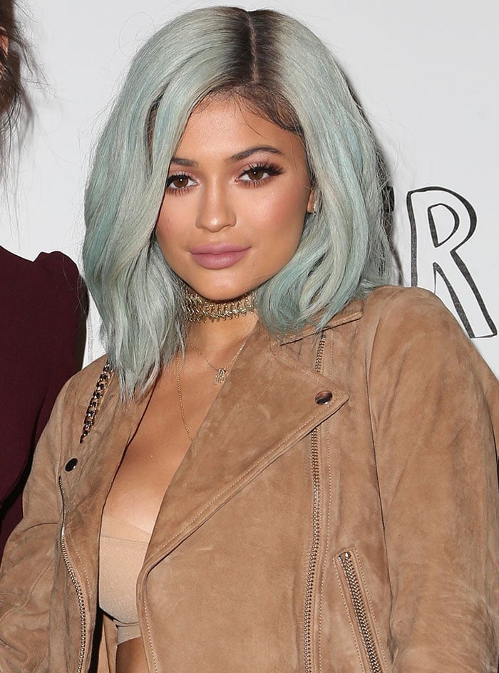 Kylie Jenner with long and thick eyelashes and pale pink lips