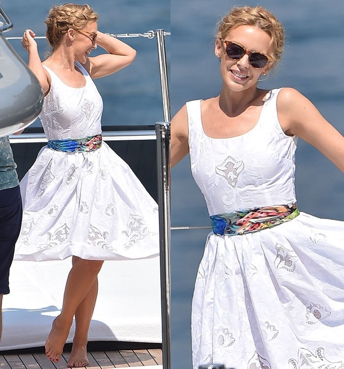 Kylie Minogue has a Marilyn Monroe moment as she twirls in a white dress on board a yacht