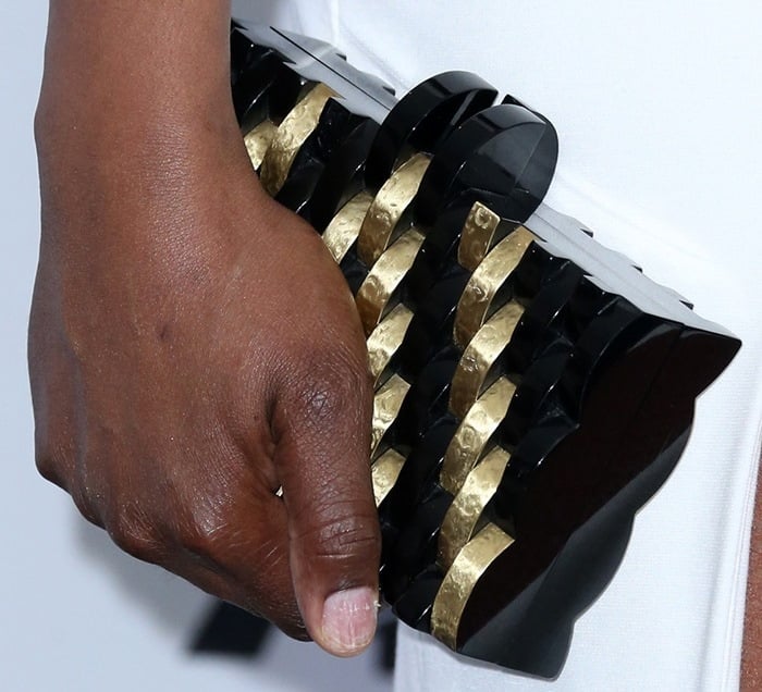 Laverne Cox carries a black-and-gold Nathalie Trad clutch