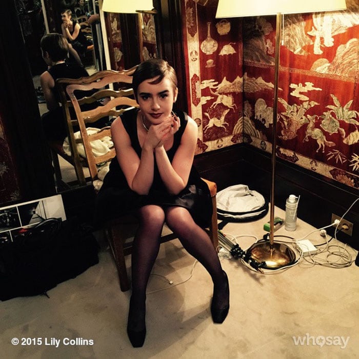 Lily Collins uploads a photo of herself sitting in a chair where Coco Chanel used to dream up her designs