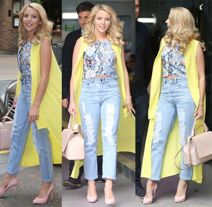 Lydia Bright in high-waisted ripped jeans and a floral crop top, paired with a bright yellow sleeveless coat