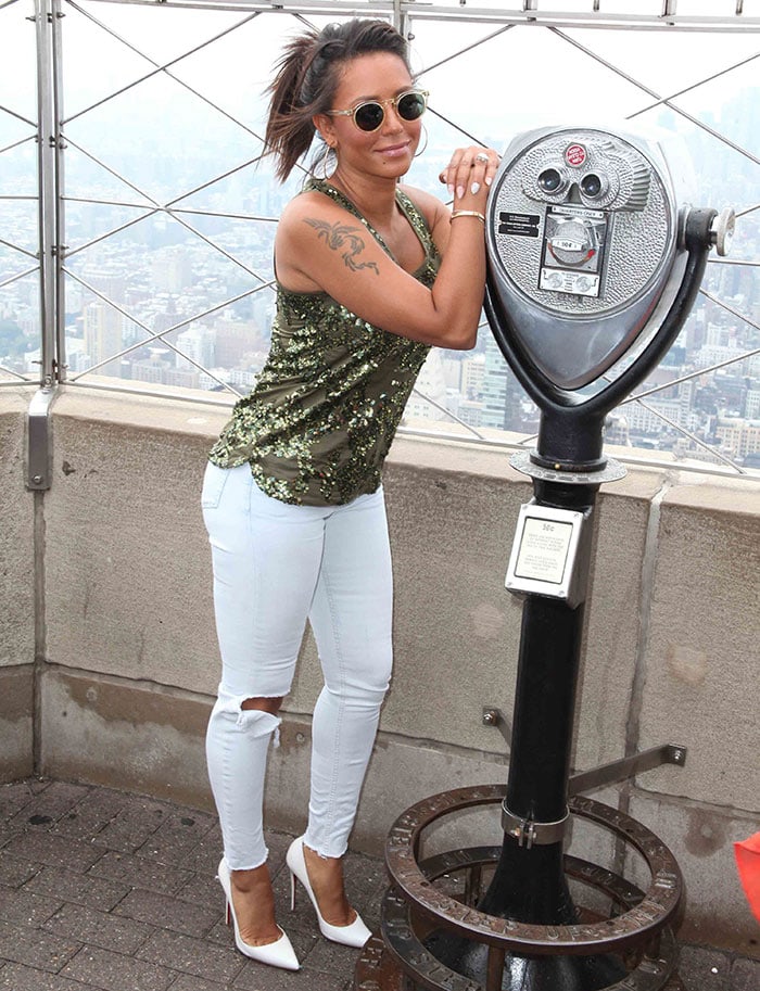 Mel B in a J. Crew green sequin tank top and white ripped jeans