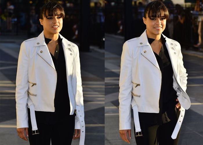 Michelle Rodriguez with a white leather jacket over her shoulders